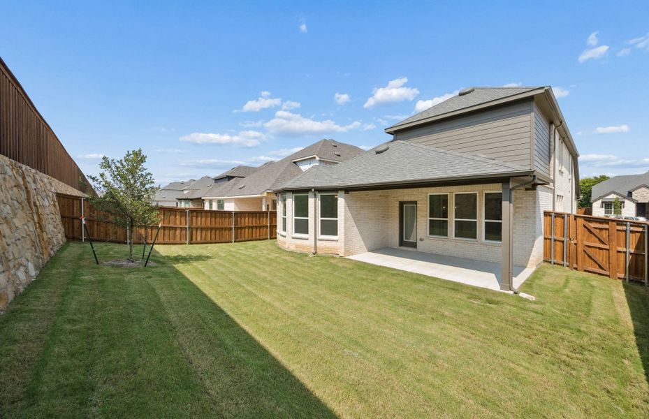 Exterior details and patio area of a home in Wilson Creek Meadows, Celina (Image 2).