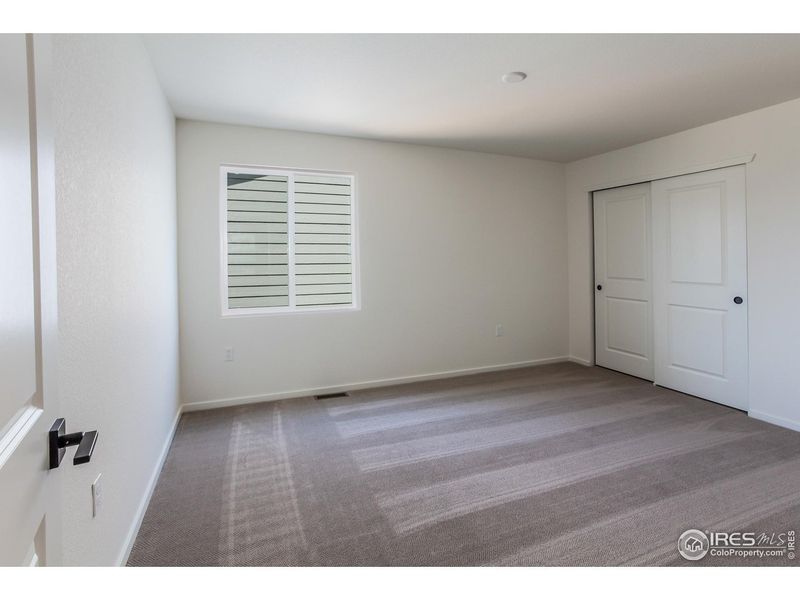 Spacious, unfurnished interior of a new home in Granary Trailblazer Collection - Single Family Homes, Johnstown (Image 18).