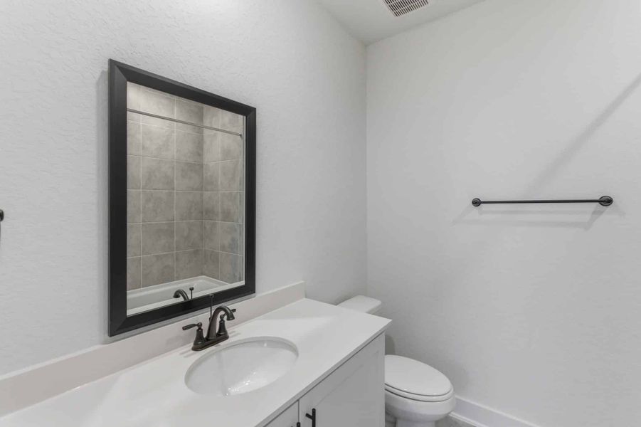 Furnished interior view inside a new home in Centero at Stone Oak, San Antonio (Image 12).