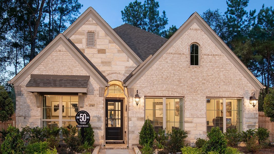 Front exterior of a new home in Briggs Ranch, San Antonio, TX, highlighting curb appeal (Image 2).