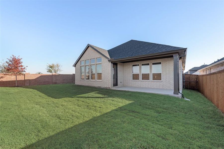 Exterior details and patio area of a home in Wildflower Ranch, Justin (Image 4).