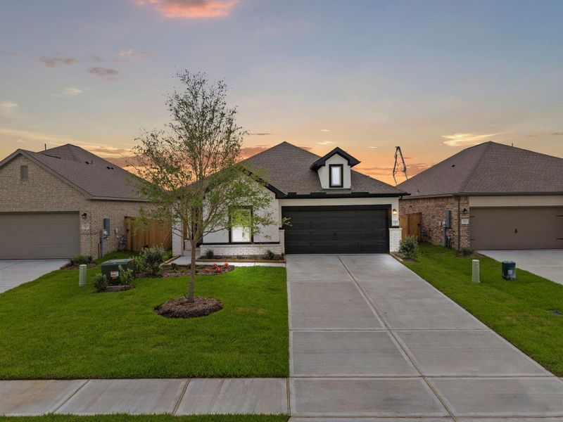 Front exterior of a new home in Windrose Green, Angleton, TX, highlighting curb appeal (Image 21).
