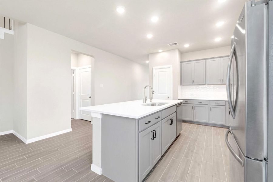 Plenty of cabinet storage all around kitchen