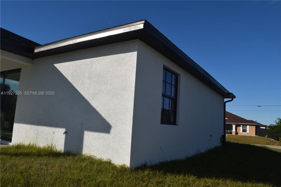 Exterior details and patio area of a home in , Lehigh Acres (Image 29). Exterior details and patio area of a home in , Lehigh Acres (Image 29).