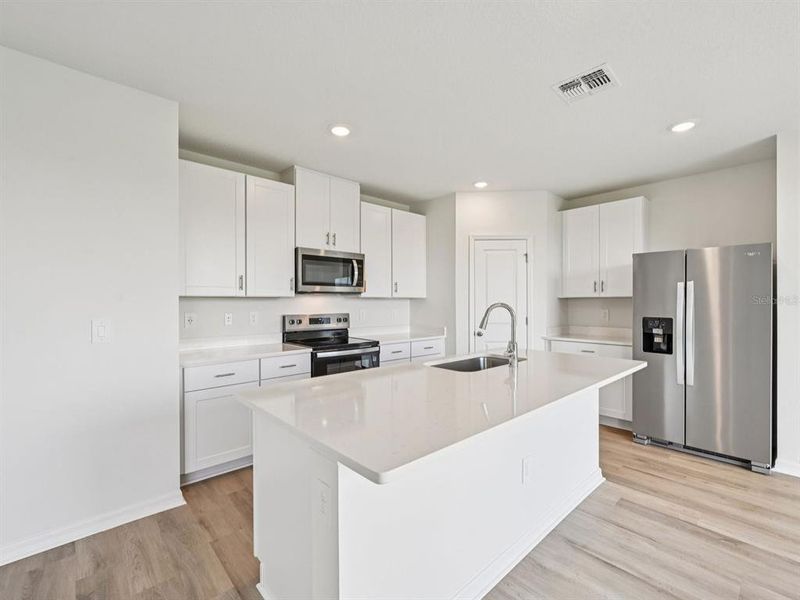 Furnished interior view inside a new home in Oakfield Trails - Signature Series, Parrish (Image 10).