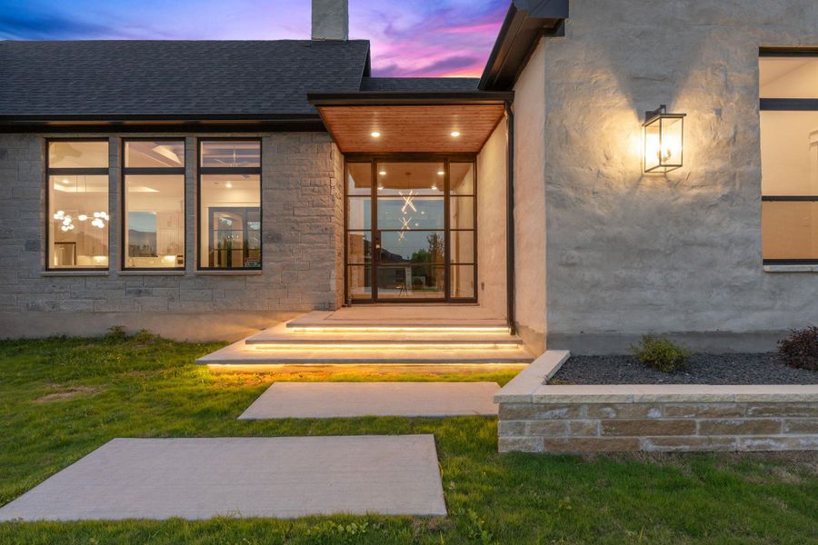 Contemporary exterior featuring stone and stucco finishes