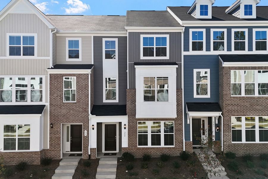 Front exterior of a new home in Renaissance at White Oak, Garner, NC, highlighting curb appeal (Image 21). Front exterior of a new home in Renaissance at White Oak, Garner, NC, highlighting curb appeal (Image 21).