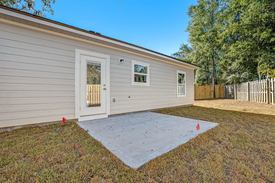 Exterior details and patio area of a home in Live Oak Cottages, Freeport (Image 22).