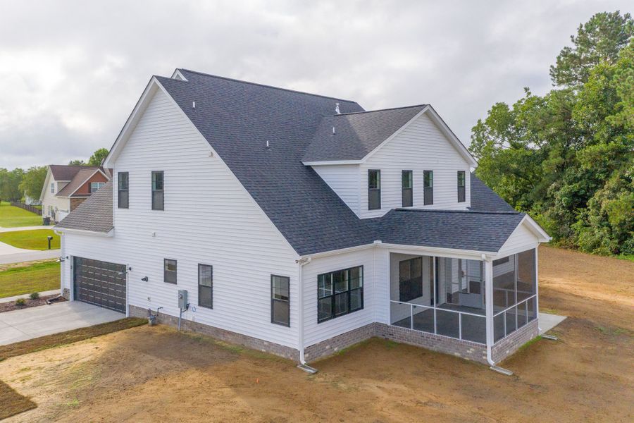 Representative exterior photo of a completed home built from the Carson by Bill Clark Homes in Cheshire Landing, Grimesland, NC (Image 36). Representative exterior photo of a completed home built from the Carson by Bill Clark Homes in Cheshire Landing, Grimesland, NC (Image 36).
