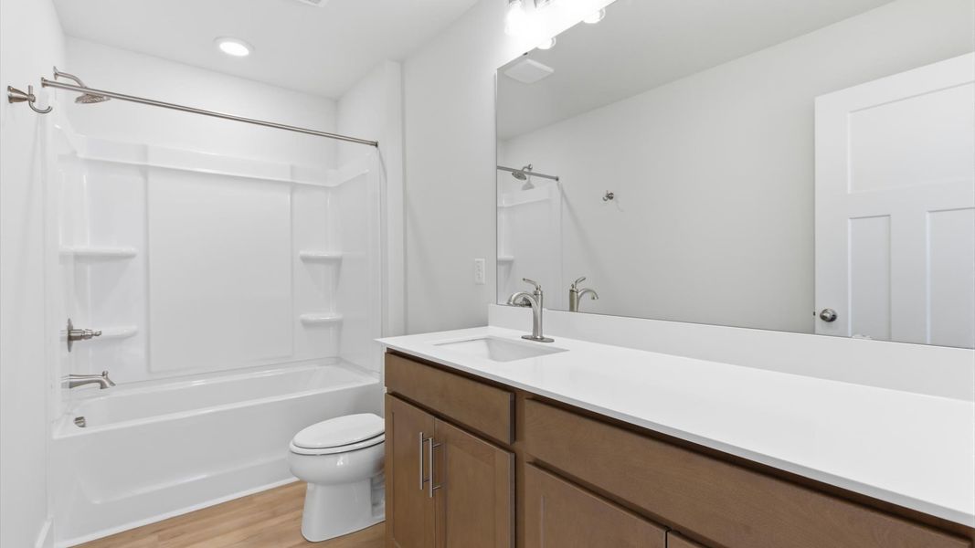 Accomplished full bath designed with both comfort and sophistication in mind