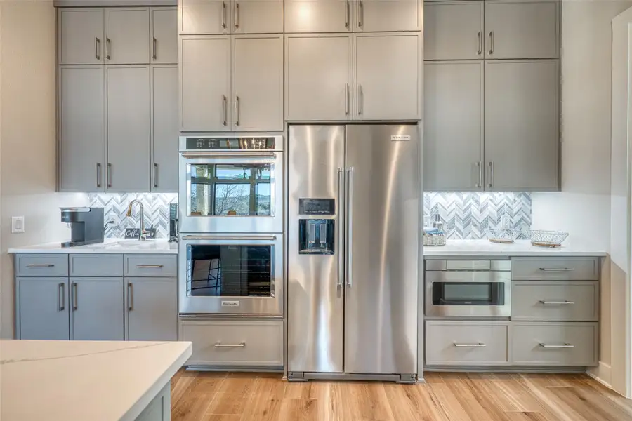 Gourmet kitchen is a chef’s dream featuring top-of-the-line appliances.