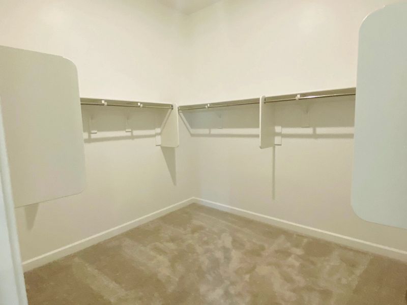 Opal plan primary walk-in closet. Options and finishes may vary by community.