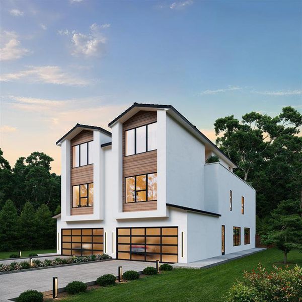 View of front of property with stucco siding, driveway, an attached garage, and a lawn