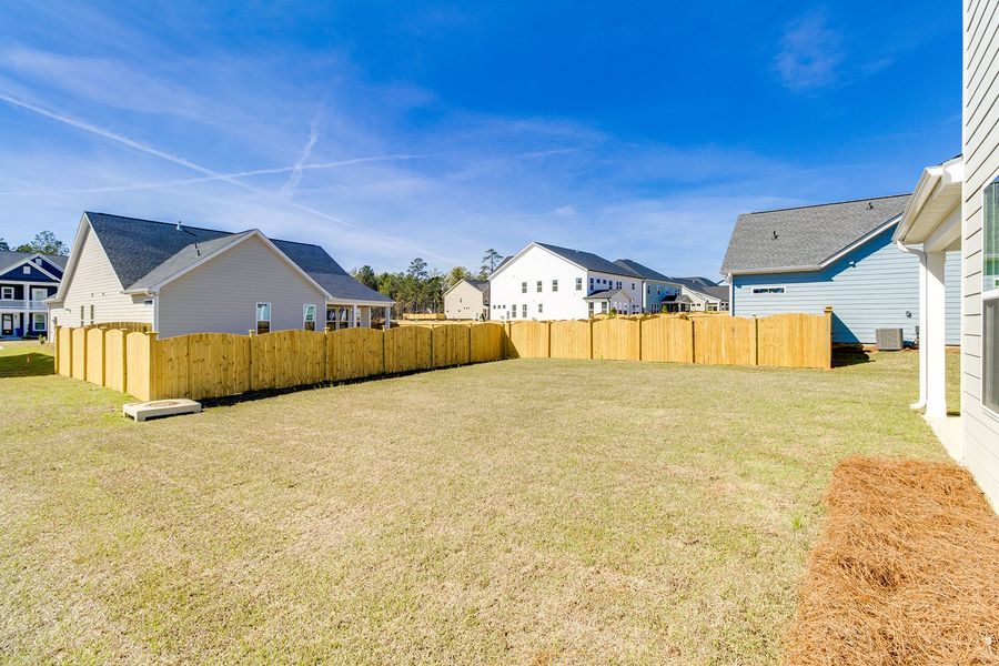 Exterior details and patio area of a home in Pebble Branch, Chapin (Image 25).