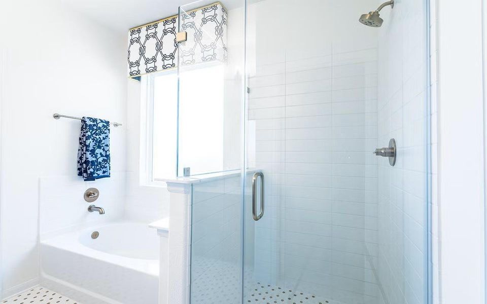 Spa inspired primary bathroom showcasing a separate soaking tub and walk in shower, bright natural light, and timeless finishes, a lovely space designed for relaxation and everyday comfort. **Photos are representative only and may vary as built.**