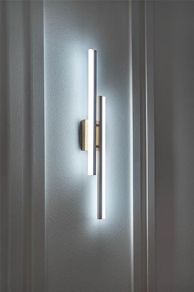 Details of wall paneling and sconce lighting