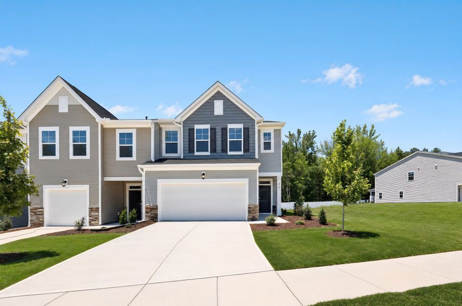 Front exterior of a new home in Parker Ridge Townes, Rolesville, NC, highlighting curb appeal (Image 1). Front exterior of a new home in Parker Ridge Townes, Rolesville, NC, highlighting curb appeal (Image 1).