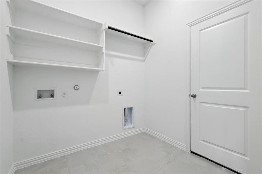 Laundry room with washer hookup, hookup for an electric dryer, and hookup for a gas dryer