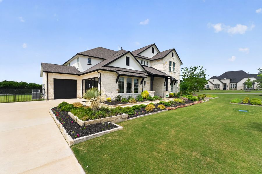 Front exterior of a new home in Highland Crossing, Celina, TX, highlighting curb appeal (Image 2).