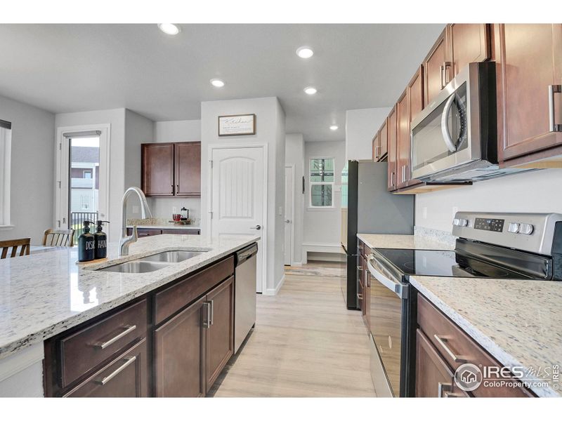 Mudroom entry and half bath conveniently located off garage near kitchen.