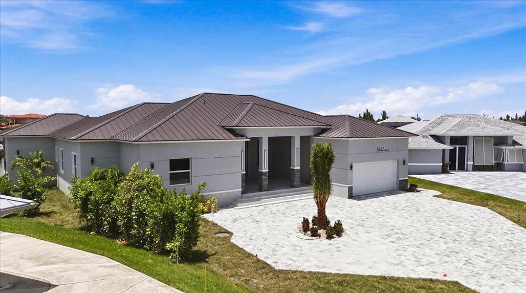 Front exterior of a new home in , Port Charlotte, FL, highlighting curb appeal (Image 1). Front exterior of a new home in , Port Charlotte, FL, highlighting curb appeal (Image 1).