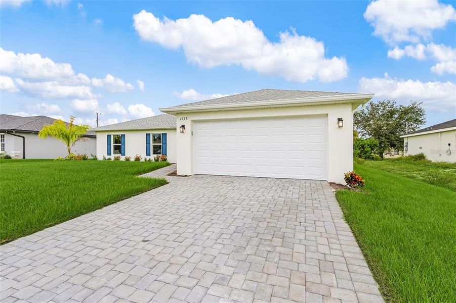 Front exterior of a new home in , Cape Coral, FL, highlighting curb appeal (Image 17). Front exterior of a new home in , Cape Coral, FL, highlighting curb appeal (Image 17).