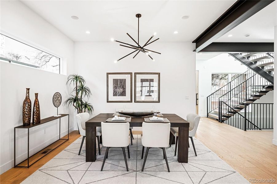 Dining is nestled next to kitchen and living area