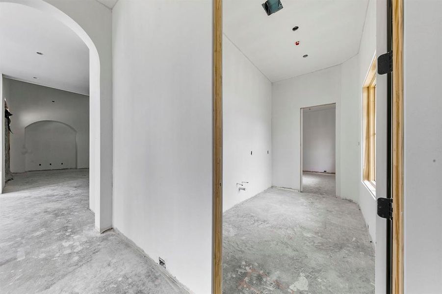 View of your private laundry room on the first floor. The second opening leads to your mud room that can be customized to your liking.