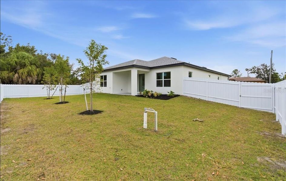 Exterior details and patio area of a home in , North Port (Image 38).