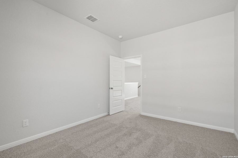 Spacious, unfurnished interior of a new home in Hunters Ranch, San Antonio (Image 28).