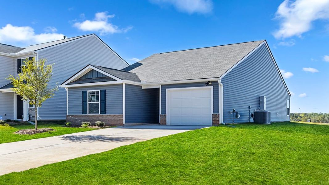 Front exterior of a new home in Harper Ridge, Roebuck, SC, highlighting curb appeal (Image 2). Front exterior of a new home in Harper Ridge, Roebuck, SC, highlighting curb appeal (Image 2).