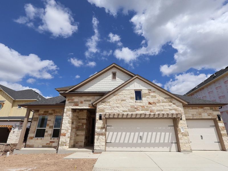 Front exterior of a new home in Barksdale, Leander, TX, highlighting curb appeal (Image 2). Front exterior of a new home in Barksdale, Leander, TX, highlighting curb appeal (Image 2).