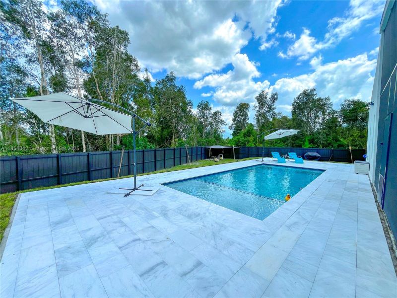 Front exterior of a new home in , Lehigh Acres, FL, highlighting curb appeal (Image 26). Front exterior of a new home in , Lehigh Acres, FL, highlighting curb appeal (Image 26).