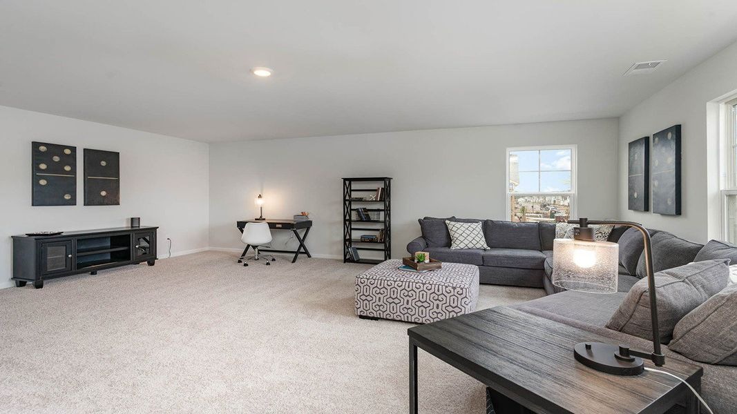Representative furnished interior of a home built from the TILLMAN by D.R. Horton in Spring View Landing, Loris (Image 20).
