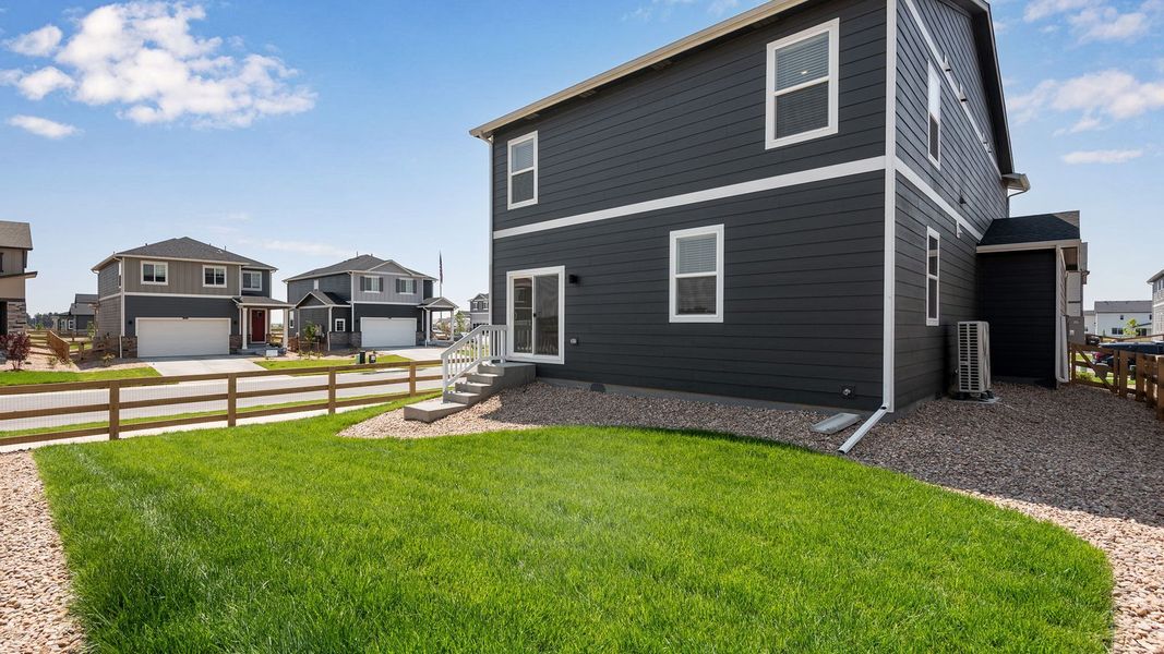 Exterior details and patio area of a home in Prairie Song, Windsor (Image 19).
