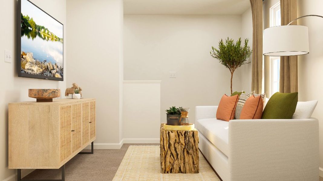 A living room with a white couch and a coffee table.