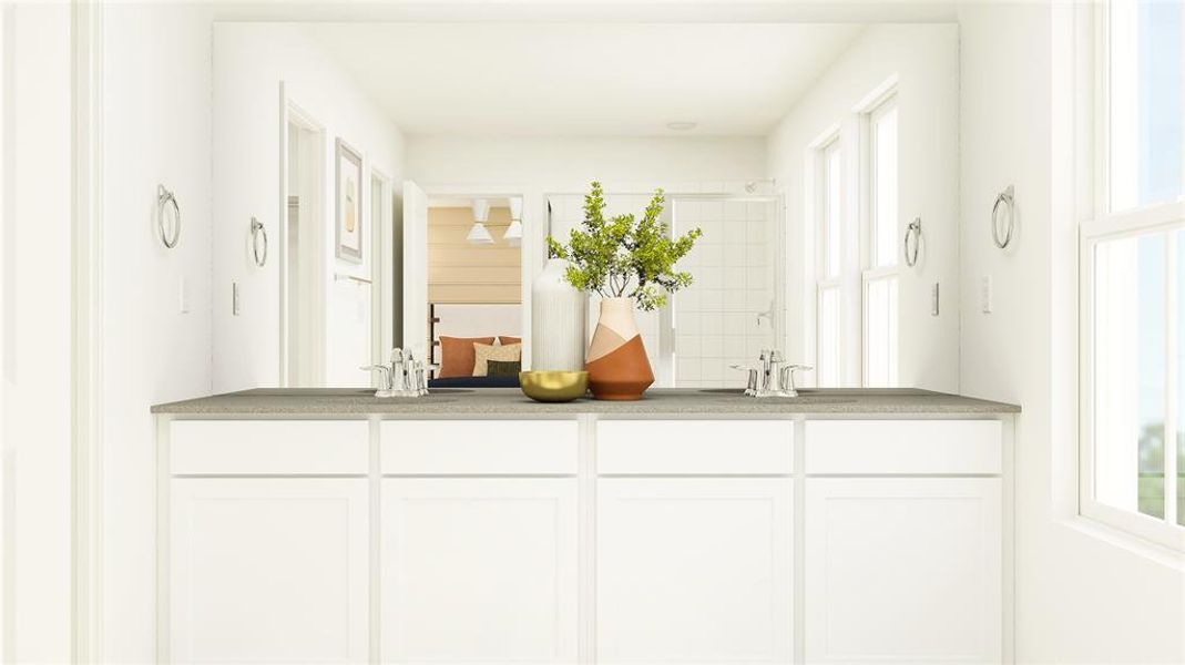 Ensuite bathroom featuring double vanity and tiled shower