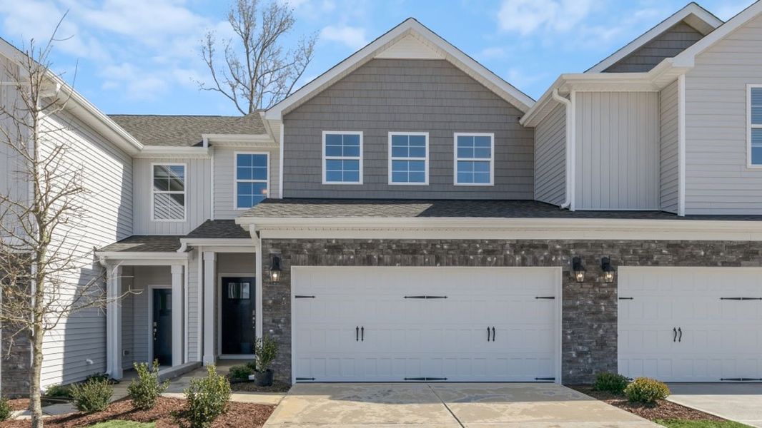 Front exterior of a new home in Lybrook Village, Advance, NC, highlighting curb appeal (Image 1). Front exterior of a new home in Lybrook Village, Advance, NC, highlighting curb appeal (Image 1).