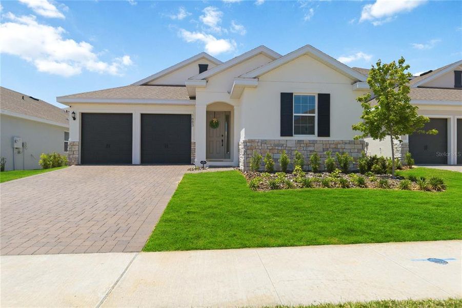 Front exterior of a new home in , Clermont, FL, highlighting curb appeal (Image 25).