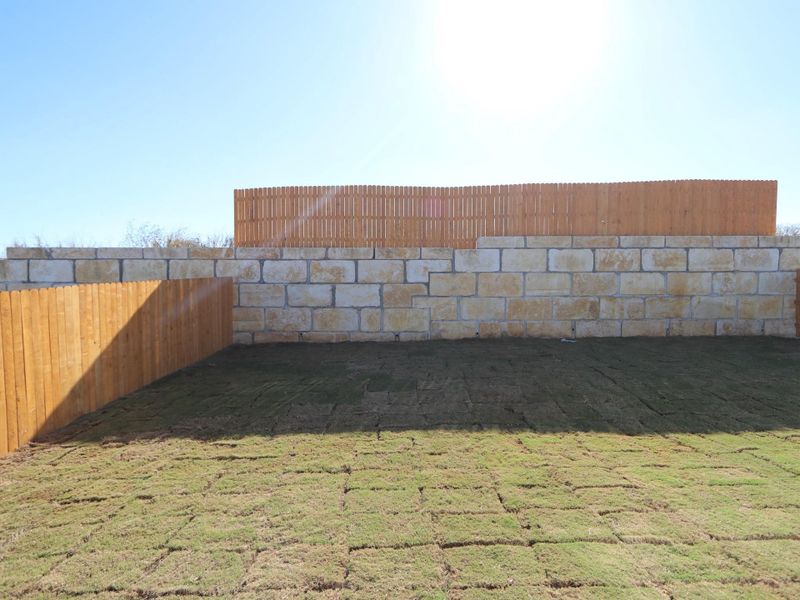 Exterior details and patio area of a home in Cascades at Onion Creek, Austin (Image 2).