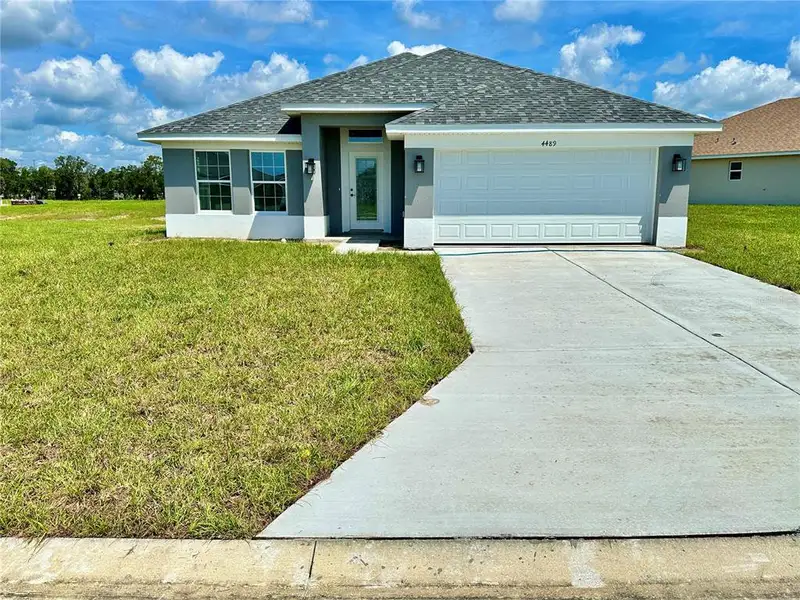 Front exterior of a new home in , Ocala, FL, highlighting curb appeal (Image 3).