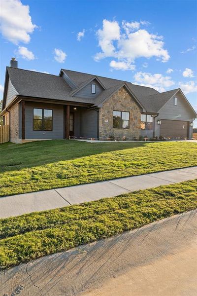 Front exterior of a new home in , Lindale, TX, highlighting curb appeal (Image 2). Front exterior of a new home in , Lindale, TX, highlighting curb appeal (Image 2).