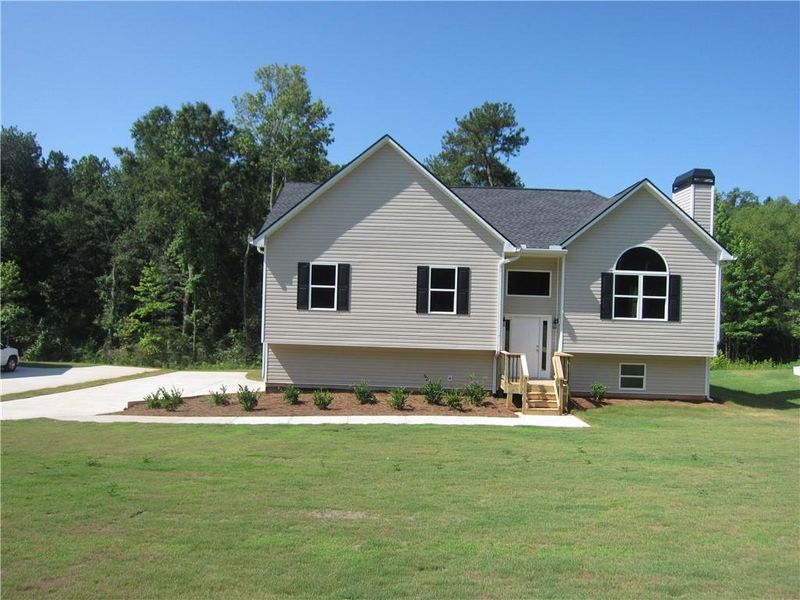 Front exterior of a new home in , Dallas, GA, highlighting curb appeal (Image 19).