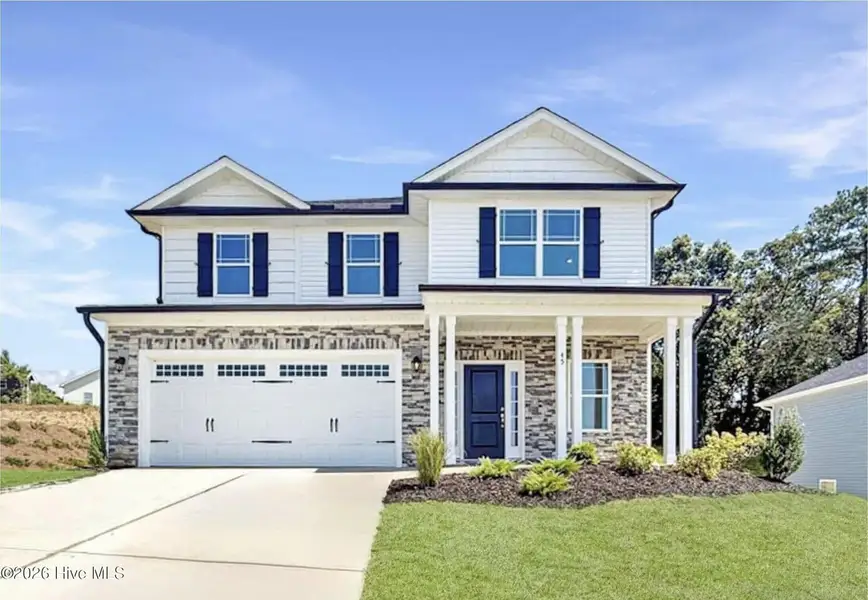 Front exterior of a new home in Patriot Pointe, Jacksonville, NC, highlighting curb appeal (Image 1). Front exterior of a new home in Patriot Pointe, Jacksonville, NC, highlighting curb appeal (Image 1).