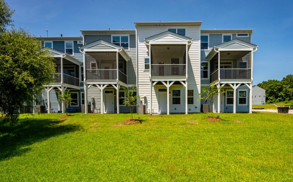 Exterior details and patio area of a home in The Bluffs at Pinefield Townhomes, Charleston (Image 19).