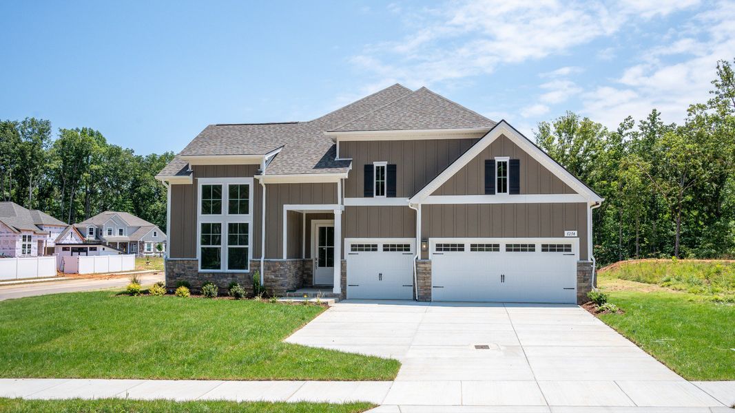 Exterior of an Evans plan home at Brush Creek in Fairview, TN with a 3-car garage Exterior of an Evans plan home at Brush Creek in Fairview, TN with a 3-car garage
