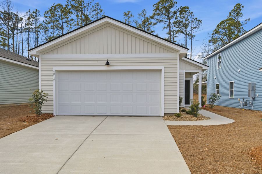 Front exterior of a new home in Grand Arbor, Blythewood, SC, highlighting curb appeal (Image 16).