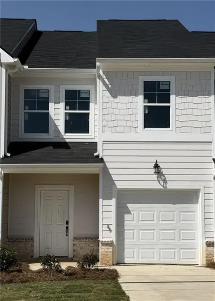 Front exterior of a new home in Village Green, Adairsville, GA, highlighting curb appeal (Image 1). Front exterior of a new home in Village Green, Adairsville, GA, highlighting curb appeal (Image 1).