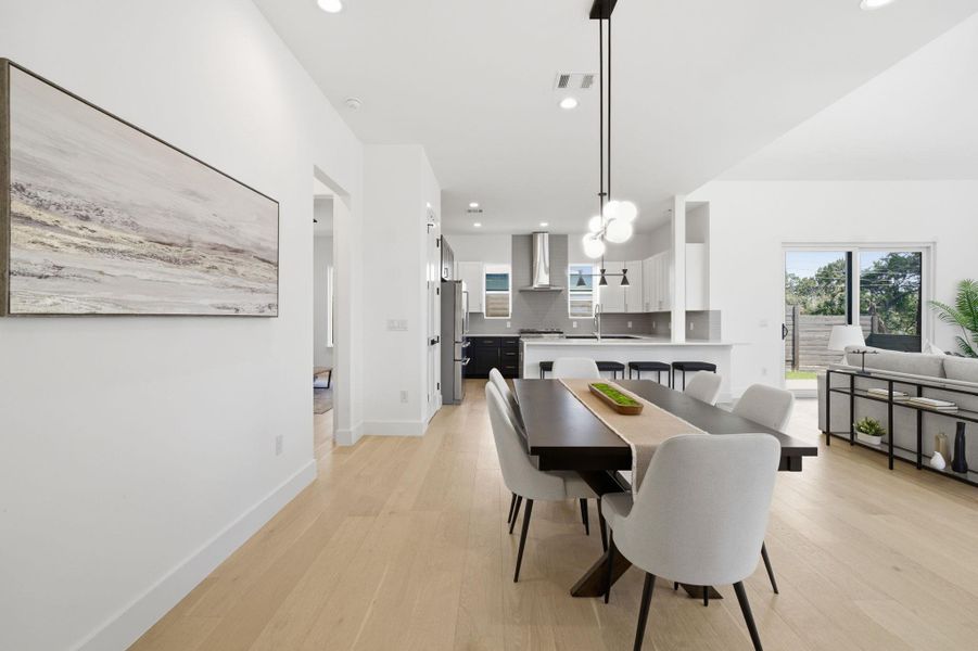Dining area featuring light wood-type flooring and recessed lighting