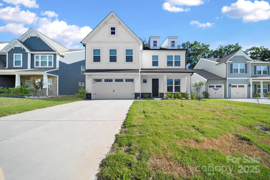 Front exterior of a new home in , Concord, NC, highlighting curb appeal (Image 1).